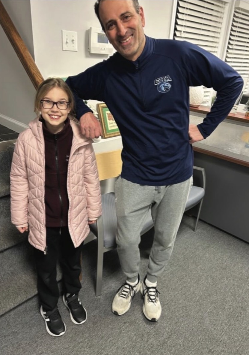 Empowered Learning Transformational Centers team member with a student